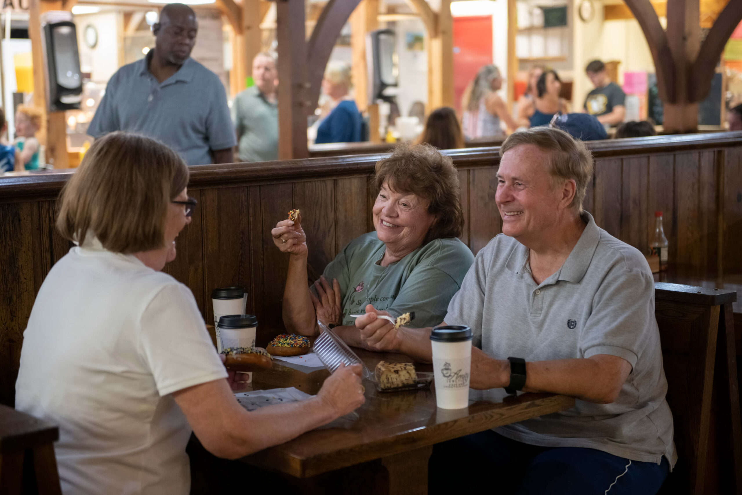 markets' customers enjoying treats from merchants in the general seating area